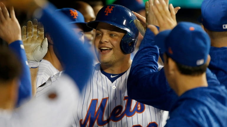 Mets catcher Devin Mesoraco celebrates his pinch-hit three-run home run in...