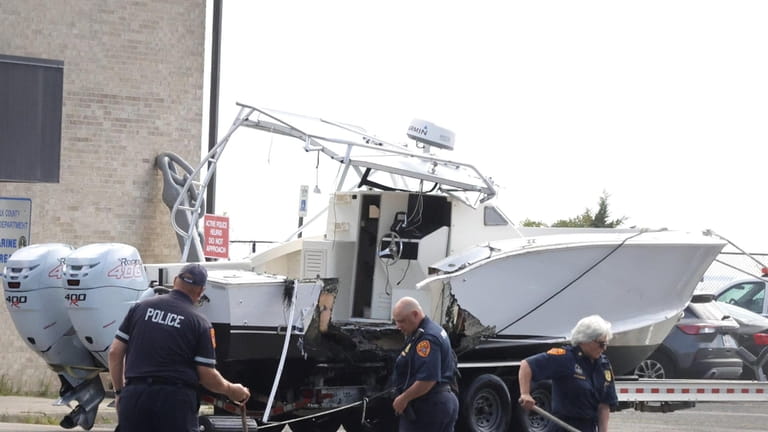 Suffolk County police at a Great River marina Monday near...
