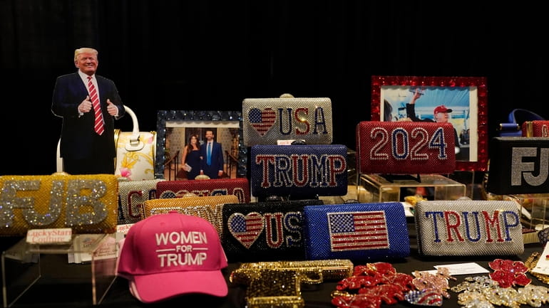 Souvenirs are displayed before former President Donald Trump's keynote speech...