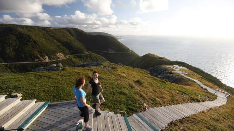 Visitors hike the Skyline Trail in Cape Breton Highlands National...