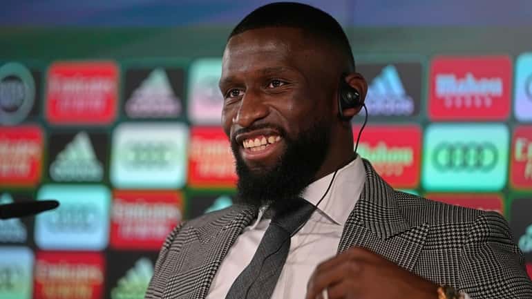 Real Madrid's new signing Antonio Rudiger smiles before the start...