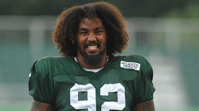 Leonard Williams of the Jets stretches during training camp at...