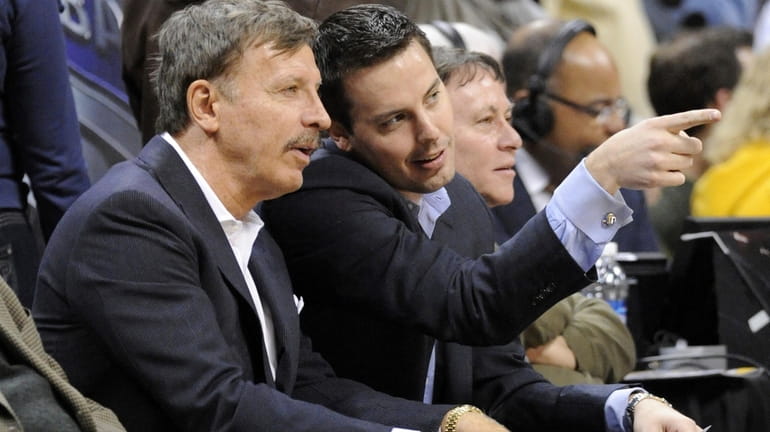 Stan Kroenke, left, owner of the Denver Nuggets, and his...