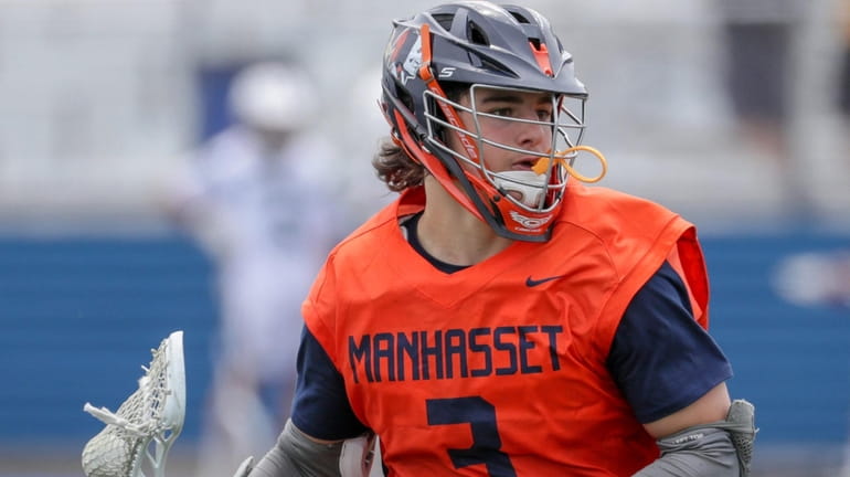 Marc Psyllos #3 of Manhasset moves the ball up field...