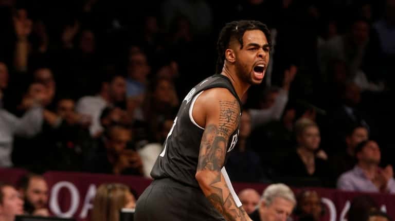 D'Angelo Russell #1 of the Brooklyn Nets reacts after teammate...
