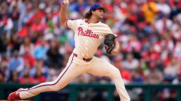 Philadelphia Phillies' Aaron Nola pitches during the first inning of...
