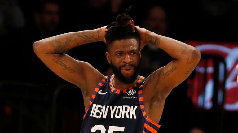 Reggie Bullock #25 of the Knicks reacts during the second...