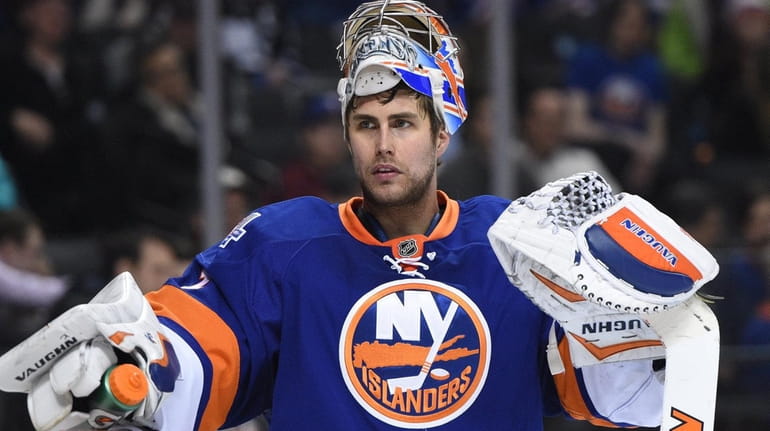 New York Islanders goalie Thomas Greiss looks on against the...
