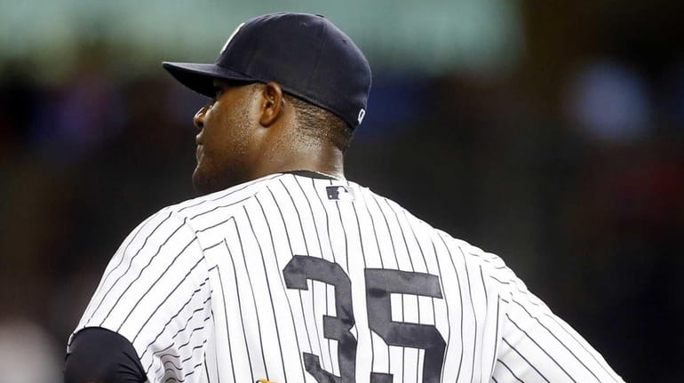 Michael Pineda of the Yankees looks on after surrendering a...