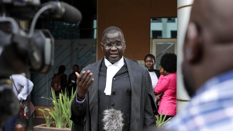 Nicholas Opiyo, Petitioner and Human rights advocate, speaks to journalists...