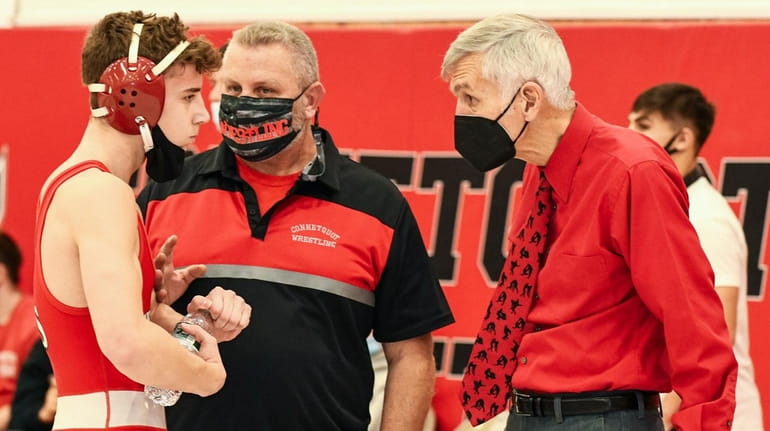 Connetquot wrestling coaches Bill Santoro (right) and Anthony Melfi (left) speak...