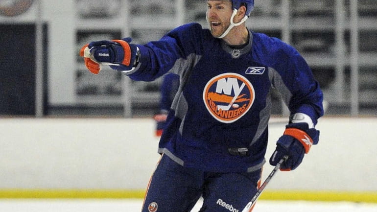 Matt Carkner skates during the New York Islanders training camp....