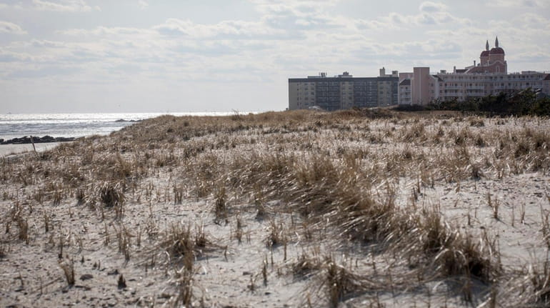 Lido Beach, shown Thursday with protective sand dunes in the...