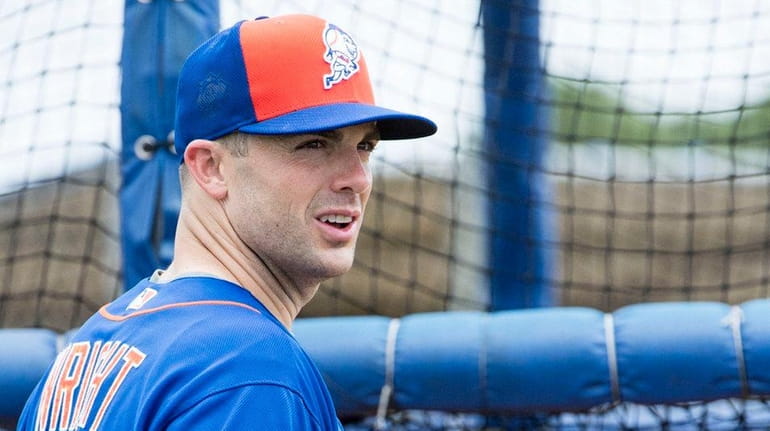 Mets captain David Wright looks on during a spring training...