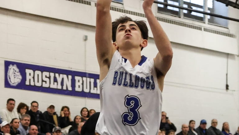 Jake Kenyon of Roslyn puts up the shot during a...