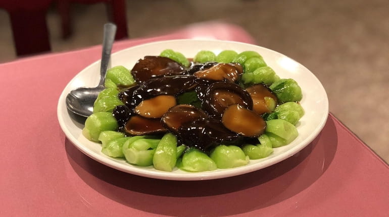Bok choy with black mushrooms is served at Cheng Du...