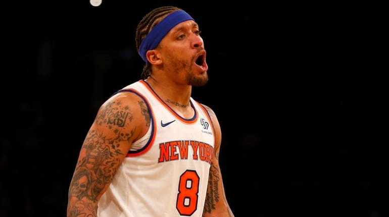 Michael Beasley #8 of the New York Knicks reacts during...