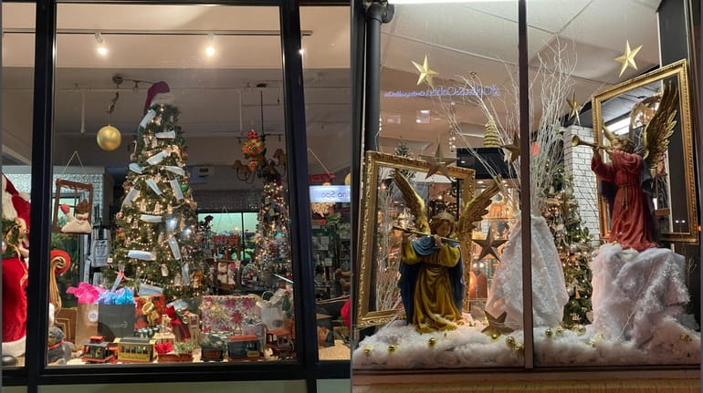 Christmas and holiday season window decorations are on display at...