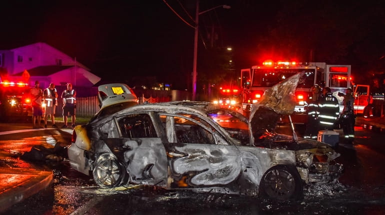 A woman was pulled from a burning vehicle in Hauppauge...
