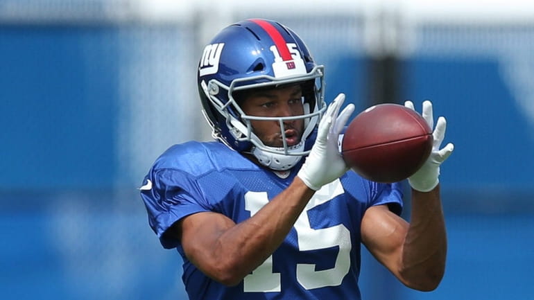 Giants wide receiver Golden Tate catches a pass during training...