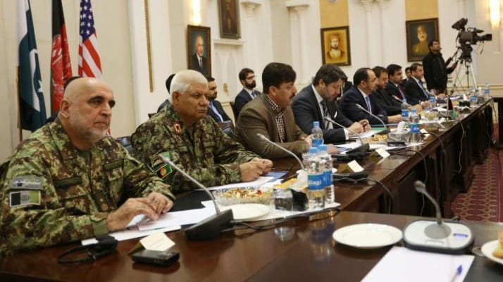 Afghan delegates attend a meeting to discuss a road map...