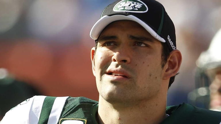 New York Jets quarterback Mark Sanchez looks up from the...