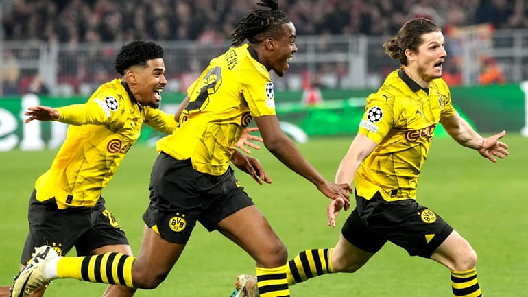 Dortmund's Marcel Sabitzer, right, celebrates his side's 4th goal during...