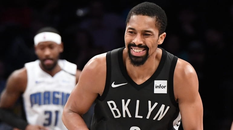 Brooklyn Nets guard Spencer Dinwiddie reacts after he sinks a...