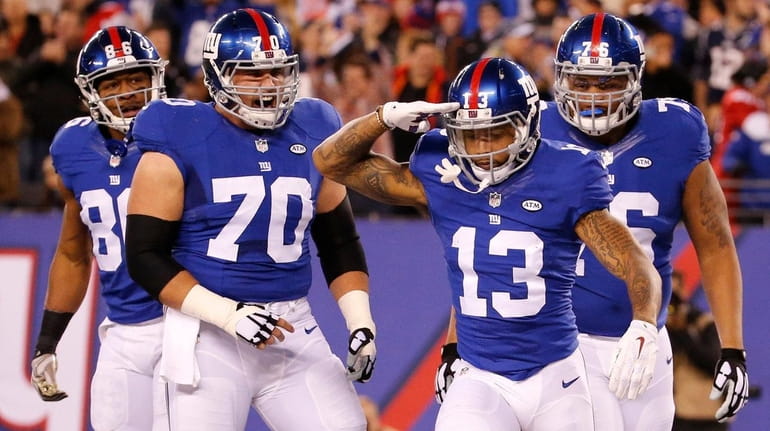 New York Giants wide receiver Odell Beckham (13) salutes as...