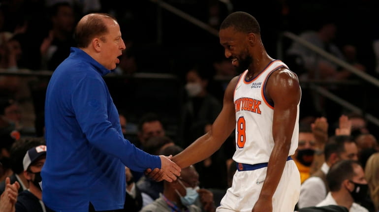 Head coach Tom Thibodeau of the Knicks greets Kemba Walker...