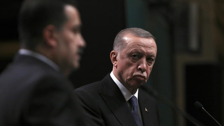 Turkey's President Recep Tayyip Erdogan, right, and Iraq's Prime Minister...