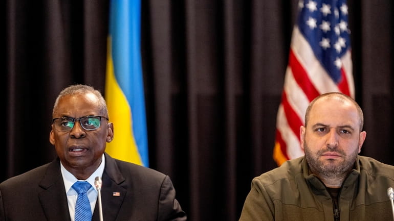 US Defense Secretary Lloyd Austin, left, flanked by Ukrainian Defence...