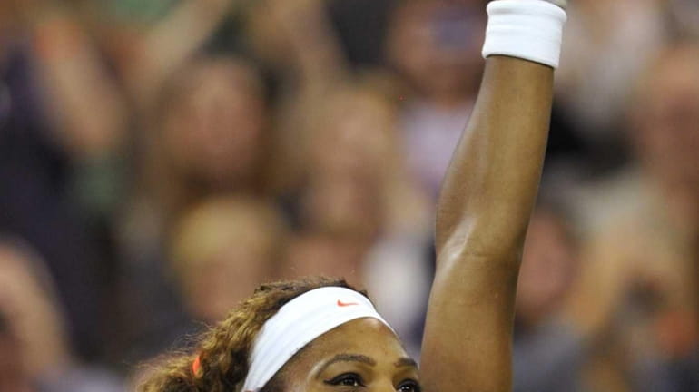 Serena Williams celebrates beating Japan's Kimiko Date-Krumm in their third...
