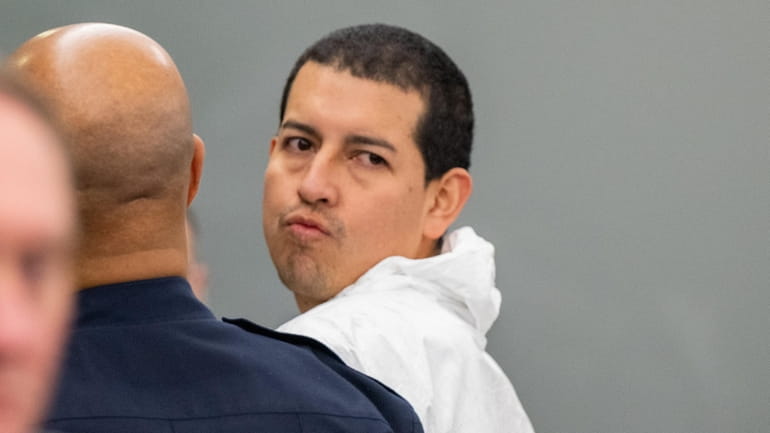 Wilson Felipe Andrade-Molina is escorted from court after his arraignment...