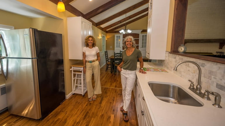Real estate investor Detra Sarris, at right with agent Risa Ziegler, is selling...
