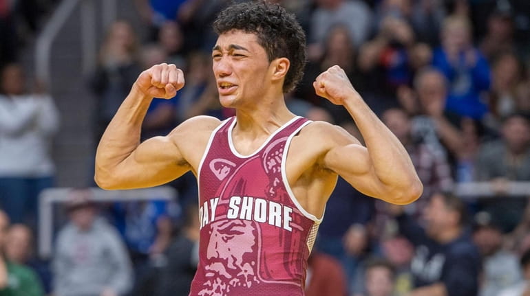 Elijah Rivera of Bay Shore rects to his overtime win to...