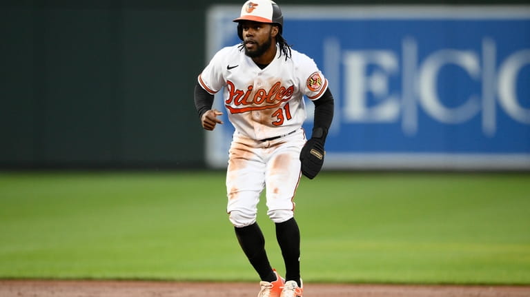 Baltimore Orioles' Cedric Mullins takes a lead during the third...