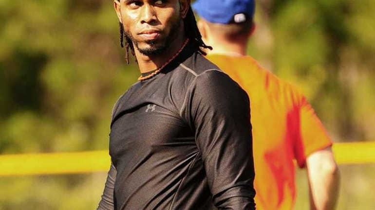 Jose Reyes looks on during workouts in Port St. Lucie,...