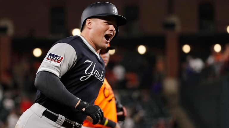 Luke Voit rounds the bases on his two-run homer in...