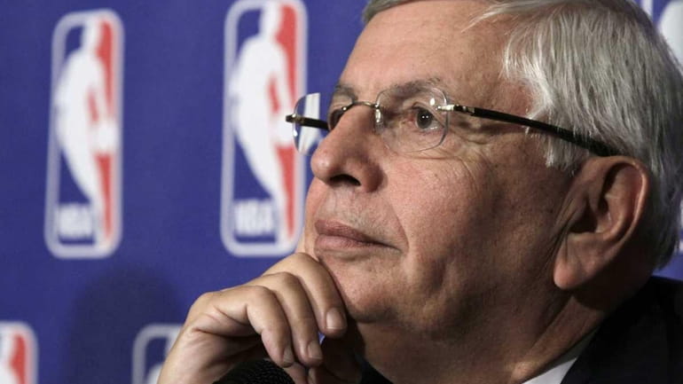 National Basketball Association commissioner David Stern listens to a question...
