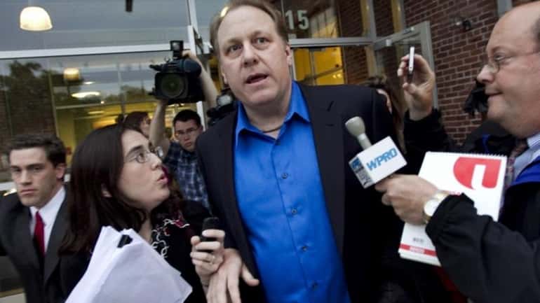 Former Boston Red Sox pitcher Curt Schilling, center, is followed...