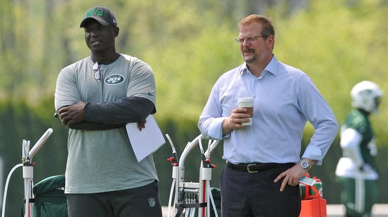 Coach Todd Bowles, left, and general manager Mike Maccagnan presided...