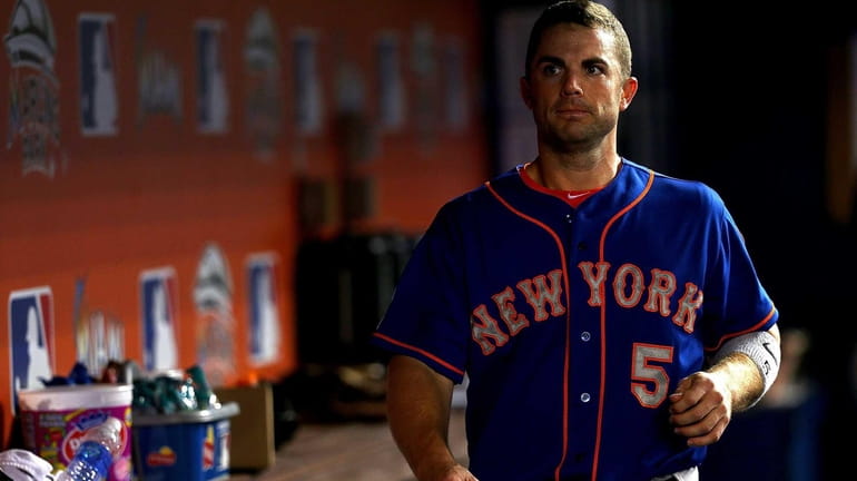 The Mets' David Wright looks on during a game against...