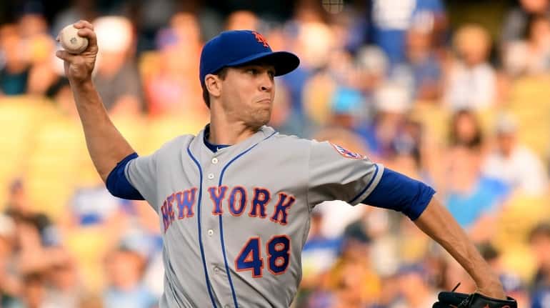 Jacob deGrom throws during the second inning against the Dodgers at...