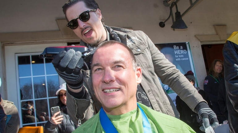 Rep. Tom Suozzi has his head shaved at a cancer-treatment...