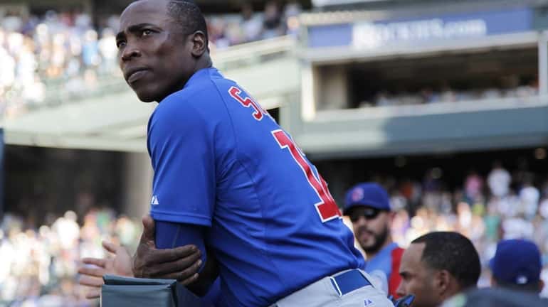 Chicago Cubs left fielder Alfonso Soriano looks on as the...