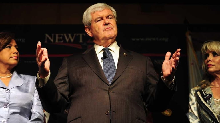 Newt Gingrich gestures while speaking to the audience in South...