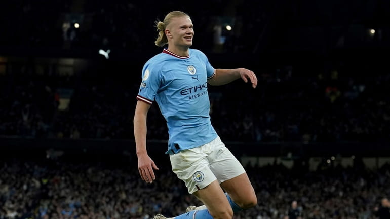 Manchester City's Erling Haaland celebrates after scoring his side's second...