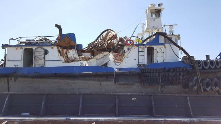 The damaged tug named Specialist sank in the Hudson River...
