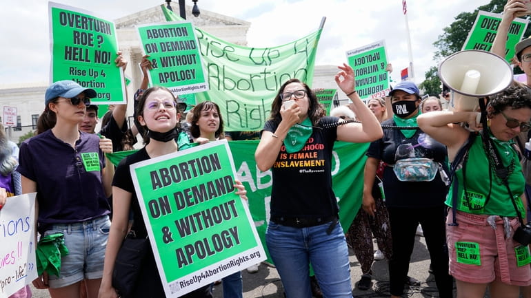 Abortion-rights activists protest after the Supreme Court decision to overturn Roe...
